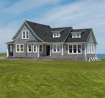 Modern farmhouse with gray-blue exterior